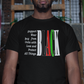 Man wearing a black t-shirt with colorful text in an urban setting