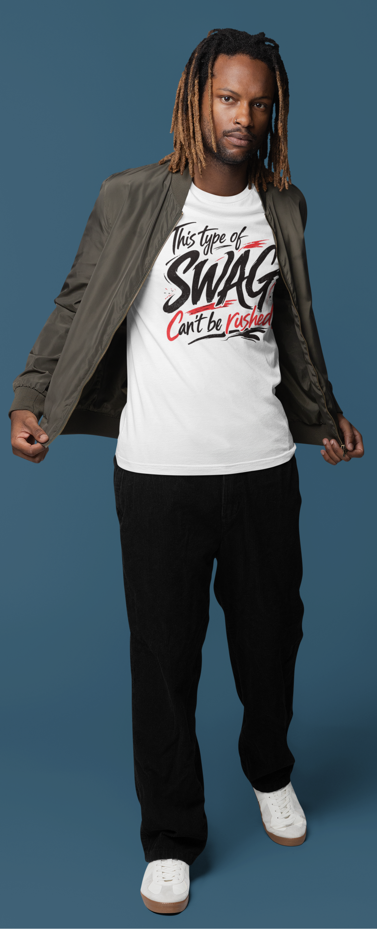 Man wearing a white t-shirt with text and a jacket on a blue background