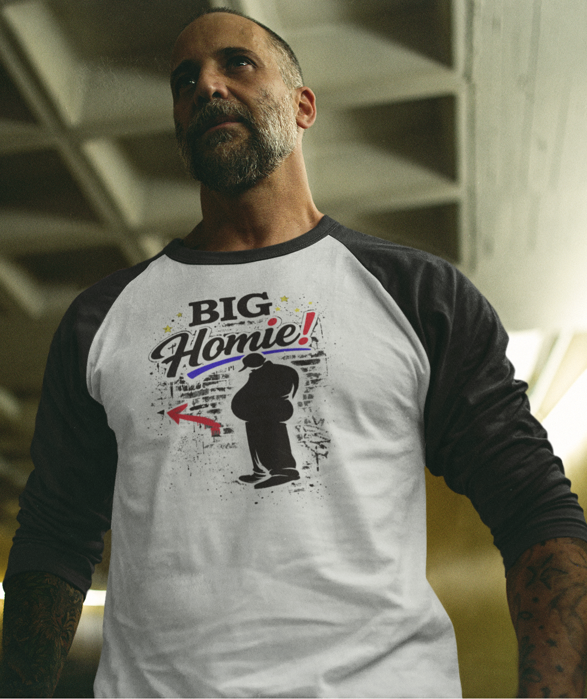 Man wearing a white and black baseball shirt with 'BIG Homie!' graphic design.
