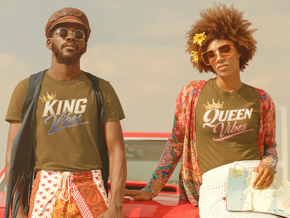 Two people standing in front of a vintage car with a suitcase, wearing matching t-shirts with 'King' and 'Queen' text.
