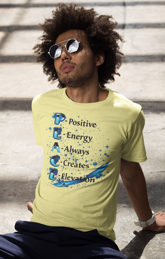 Person wearing a yellow t-shirt with a motivational design, sitting on steps.