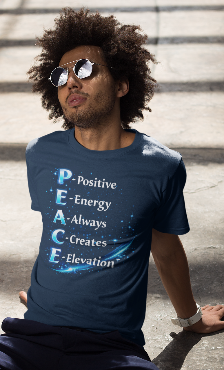 Man sitting on steps wearing a navy blue t-shirt with motivational quote
