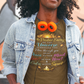 Man wearing a graphic t-shirt with colorful design in front of a mural.