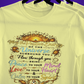 Yellow t-shirt with motivational quote on a hanger against a purple background