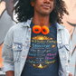 Man wearing a graphic t-shirt and green pants standing in front of a colorful mural.