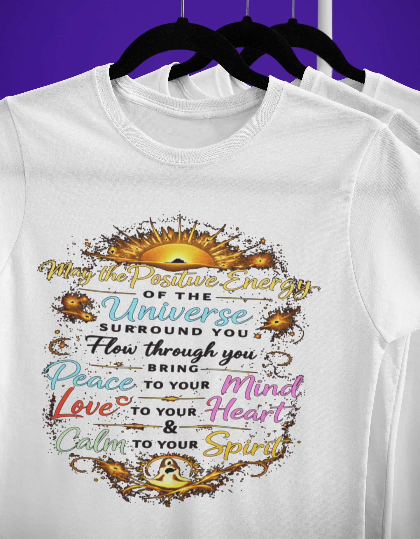 White t-shirt with motivational quote design on a purple background